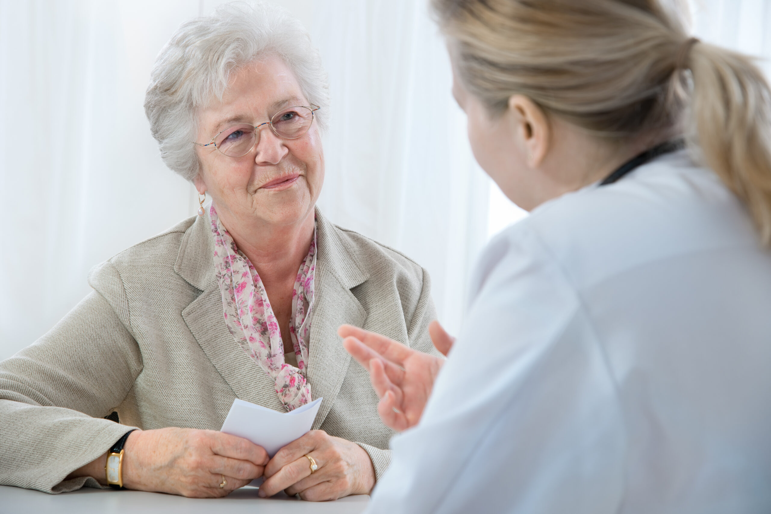 Senior speaking with doctor